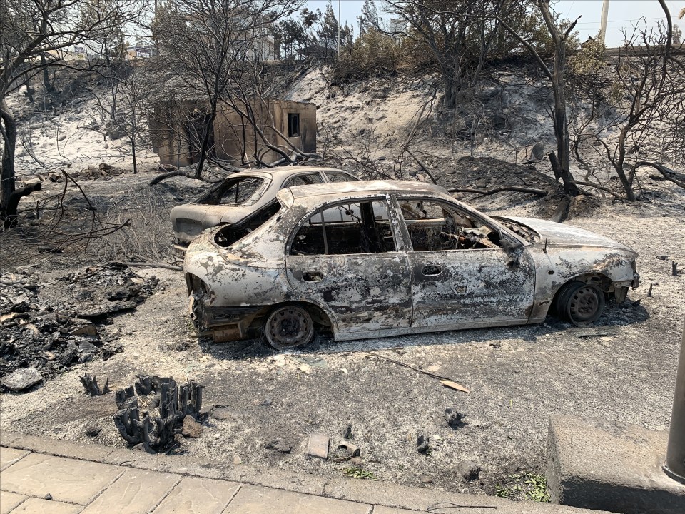 The aftermath of the fires having ripped through a village