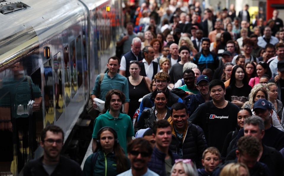 Passengers at Waterloo Station in London this morning