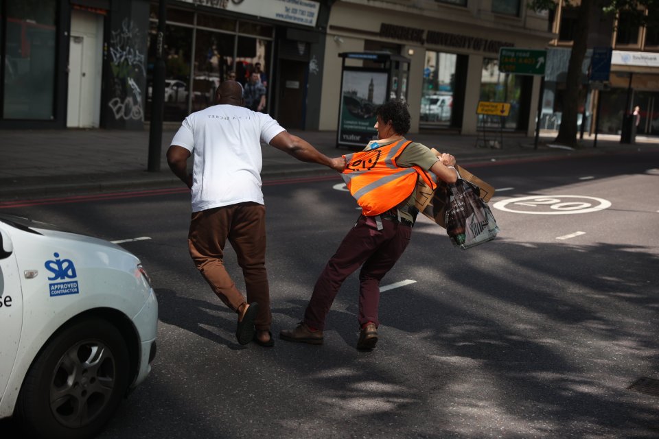 One frustrated man, who was travelling down Marylebone Road, near Westminster, had had enough as he dragged protesters