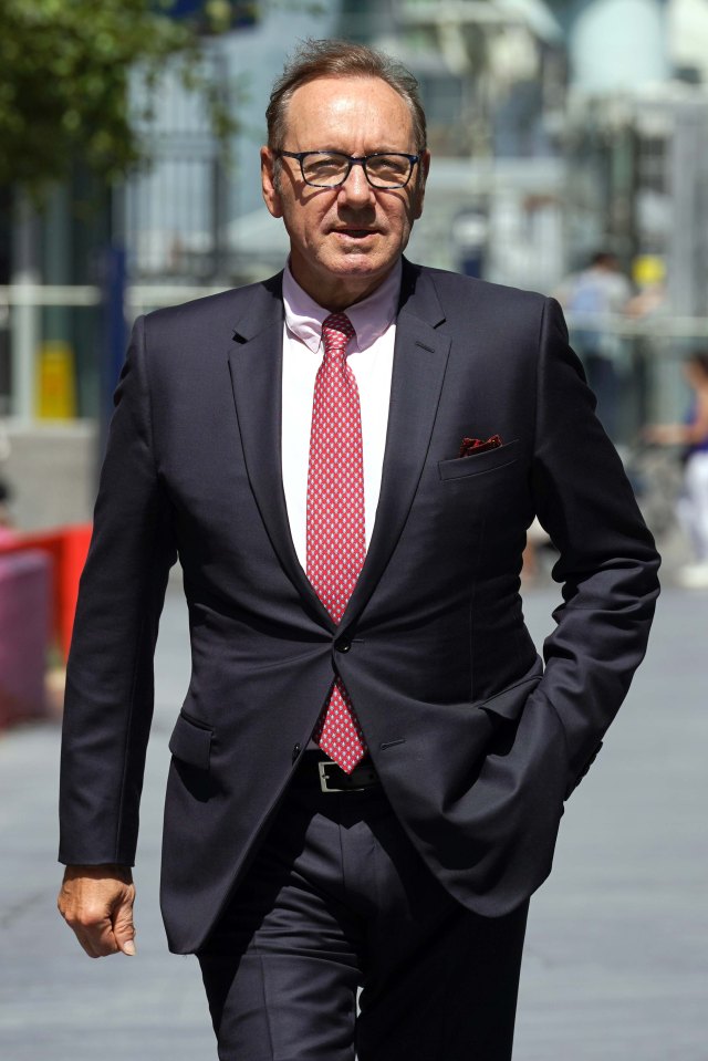 Kevin Spacey is pictured leaving court today after he was cleared of sex offences