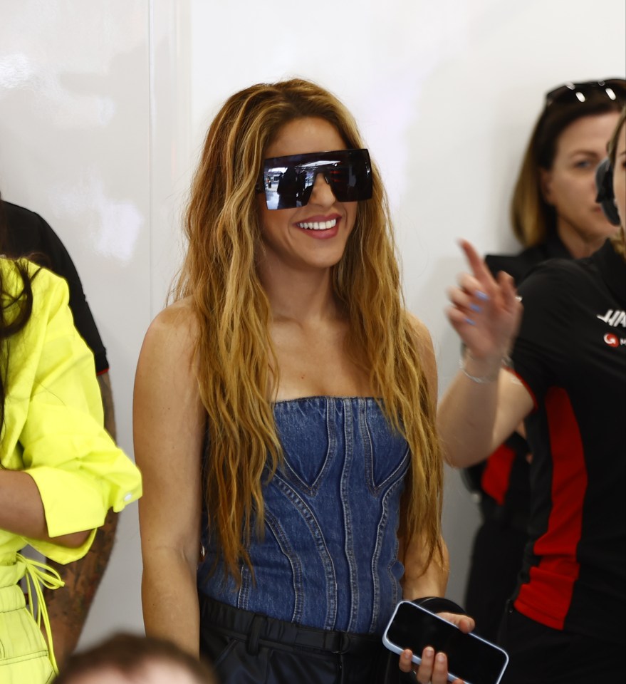 Colombian star Shakira cheers on her pal at the racing circuit