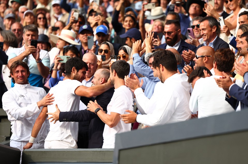 Alcaraz climbed up to his box after winning to hug his proud family