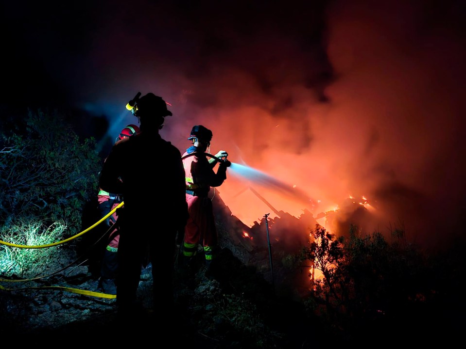 Firefighters battling the blaze that spread out of control on the island