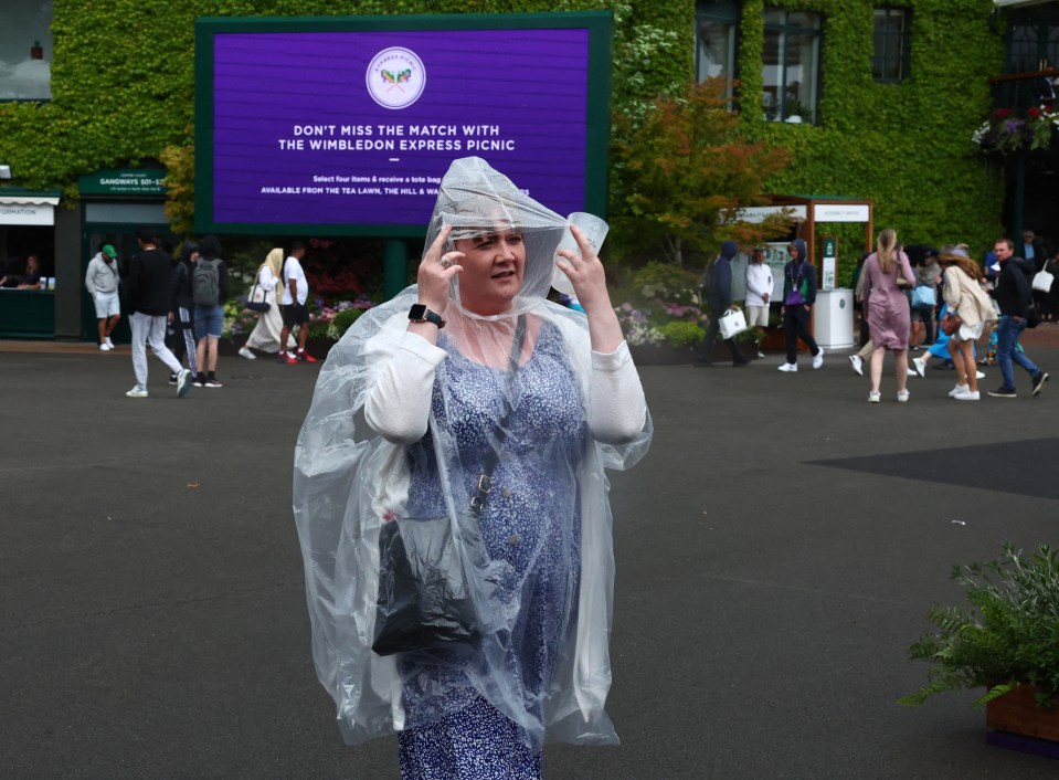 Brits used waterproof ponchos to protect themselves from the drizzle at Wimbledon on Monday