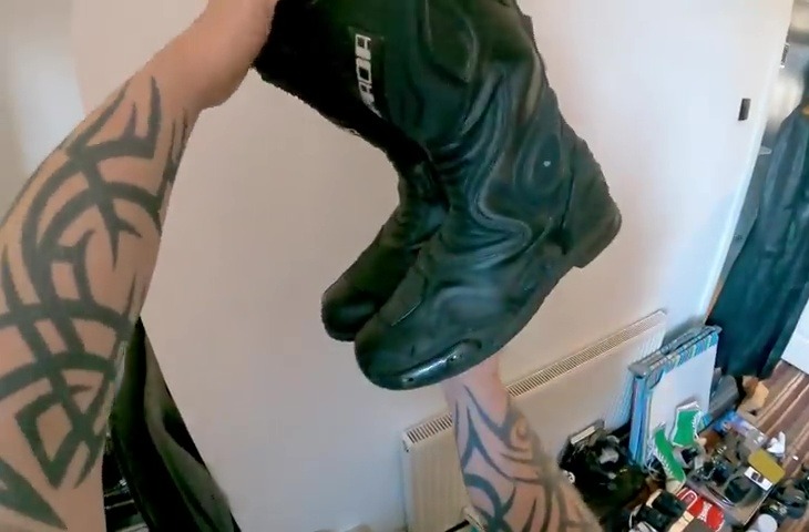 The car boot whizz showed off the motorcycle boots he nabbed