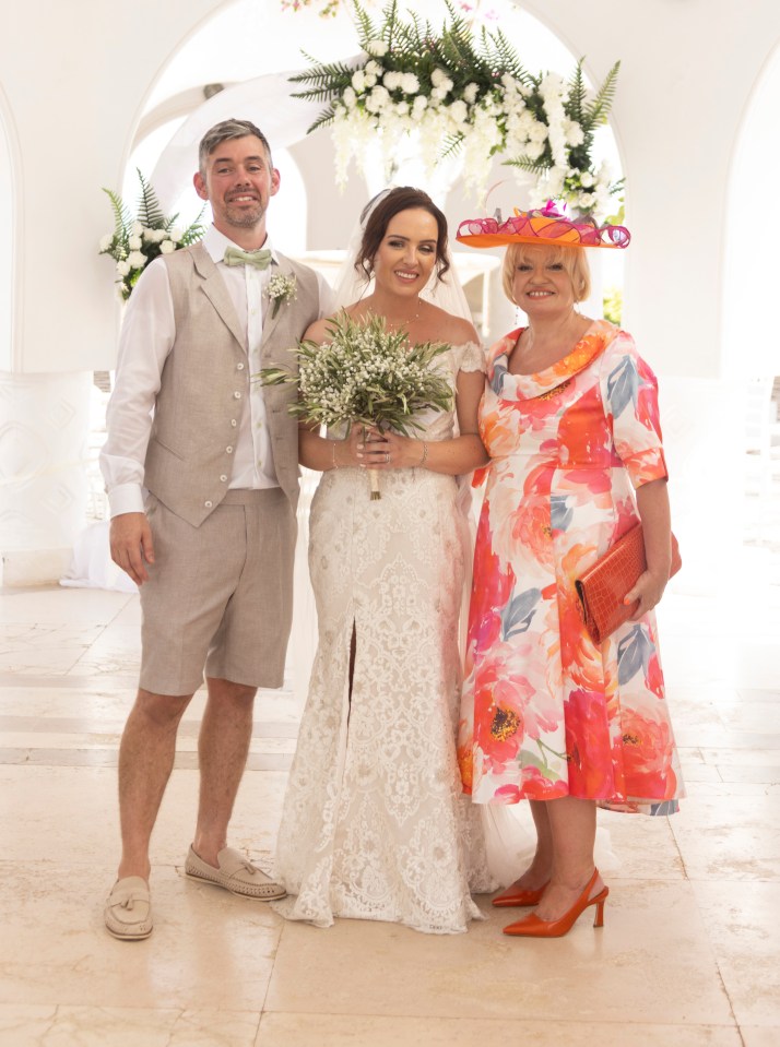 The happy couple, pictured with Kirstie's mum Amanda, shed tears of joy after making it to the altar for their dream wedding on fire-ravaged Rhodes