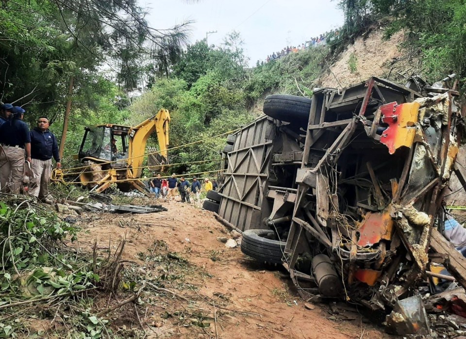 The shattered remains of the passenger bus at the bottom of the 80ft ravine