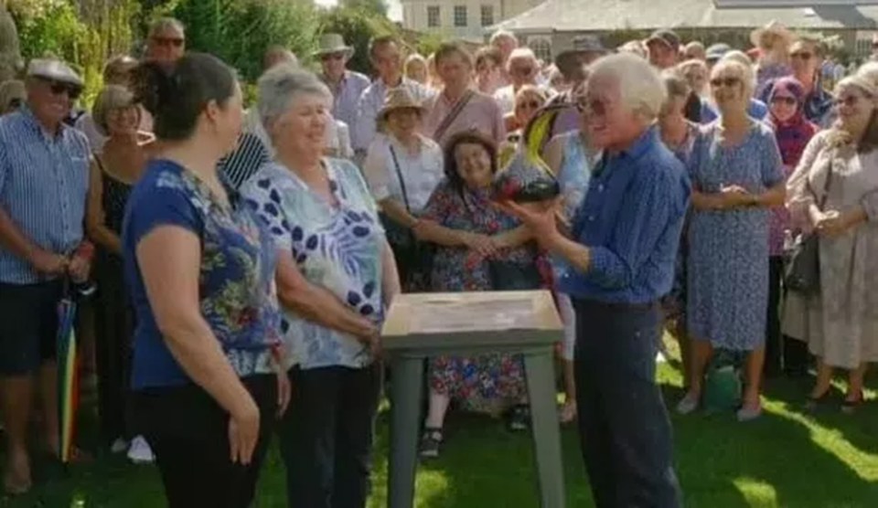 The owner looked on intensely and begged Andy not to drop her precious vase at one point