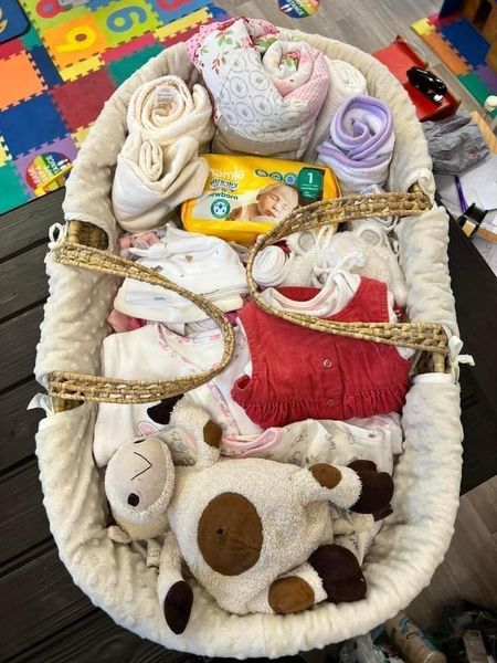 The team at Splice up Moses baskets with nappies, toys and baby clothes for expectant mums