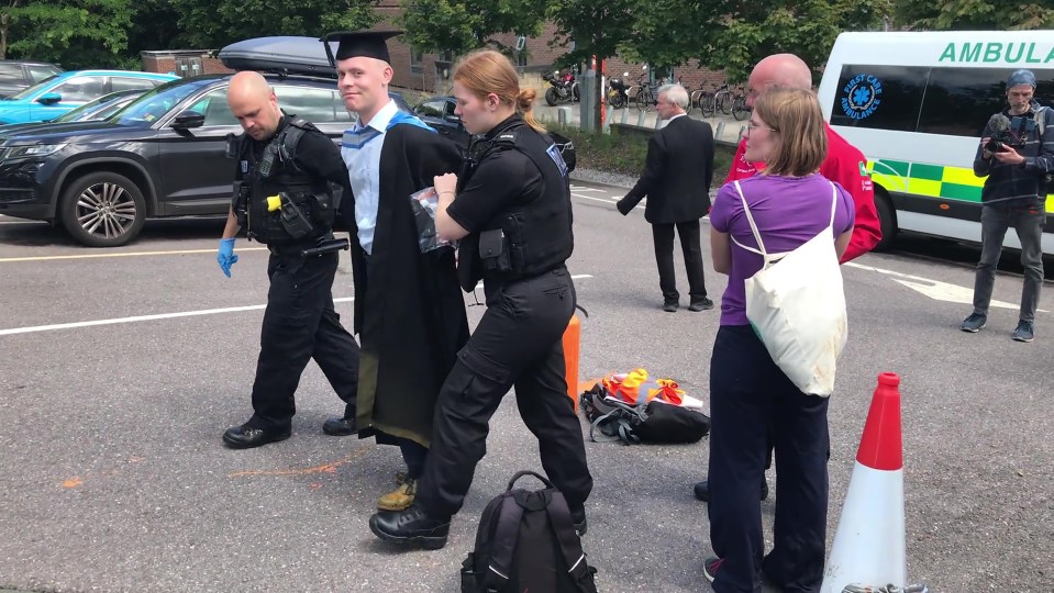 Just Stop Oil Exeter University graduation protest arrest - SCREEN GRAB TAKEN FROM VIDEO: //twitter.com/JustStop_Oil/status/1680944994855575553?ref_src=twsrc%5Egoogle%7Ctwcamp%5Eserp%7Ctwgr%5Etweet