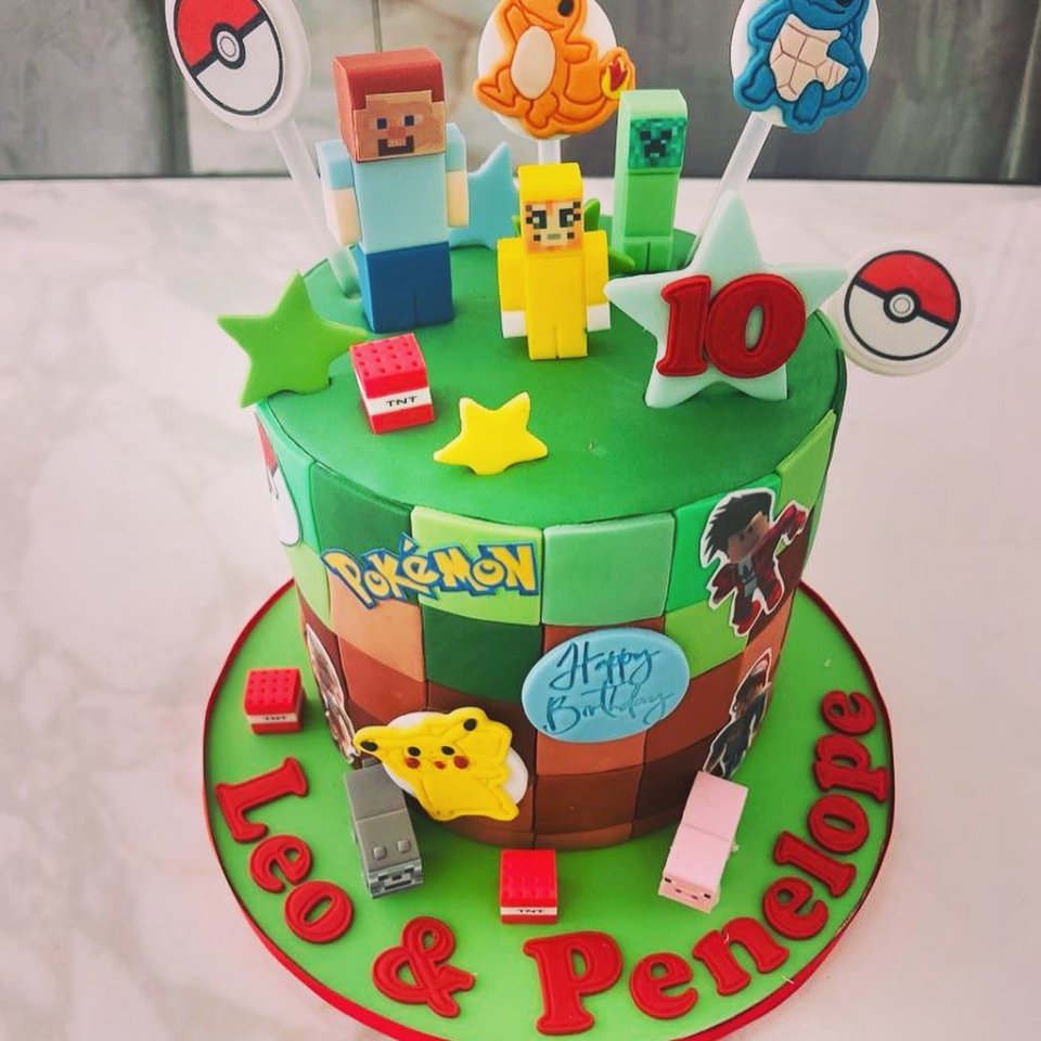 The proud parents got the twins a huge joint birthday cake which featured Minecraft and Pokémon characters