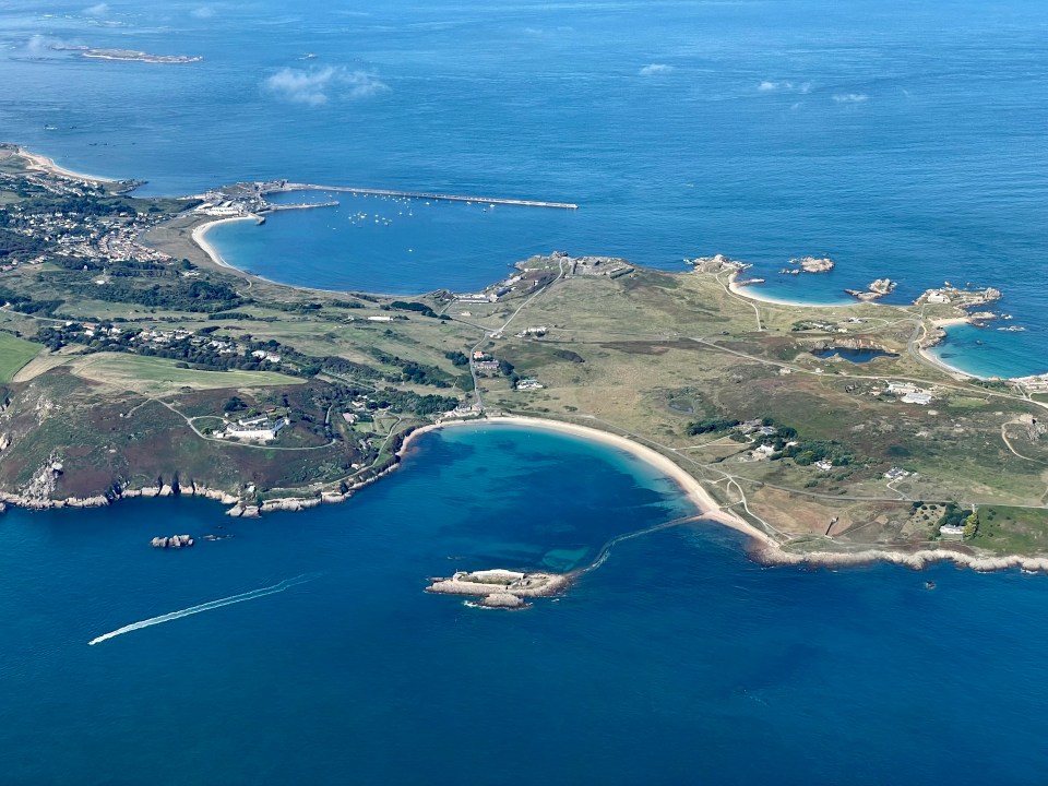 Alderney (pictured) has its own airport with direct flights to the UK mainland