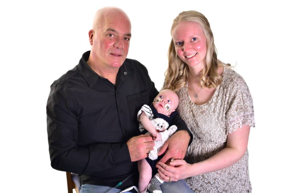 Michael Vickers and Emma Clarke with baby Olly, who died in February last year