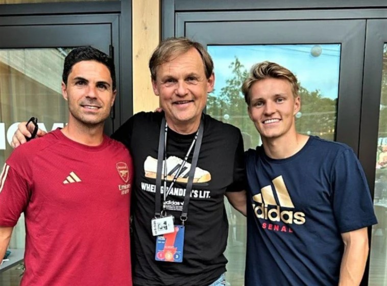 Mikel Arteta and Martin Odegaard posed alongside the head of Adidas Germany Bjorn Gulden