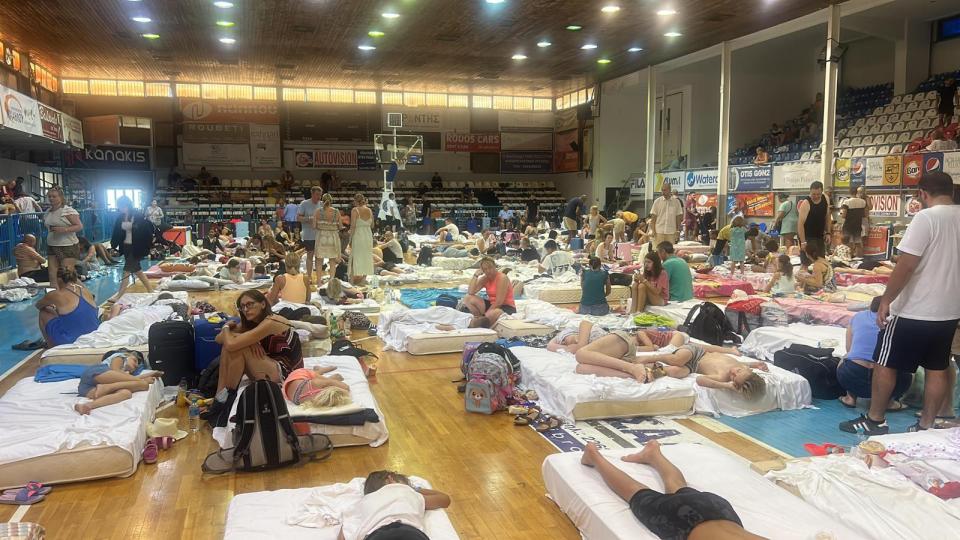 Pictures show tourists, including man Brits, sleeping on mattresses in school gyms after the evacuation