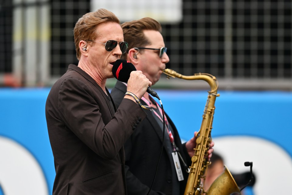 Damian Lewis (left) sang the national anthem ahead of the Grand Prix at Silverstone in the style of Elvis Presley