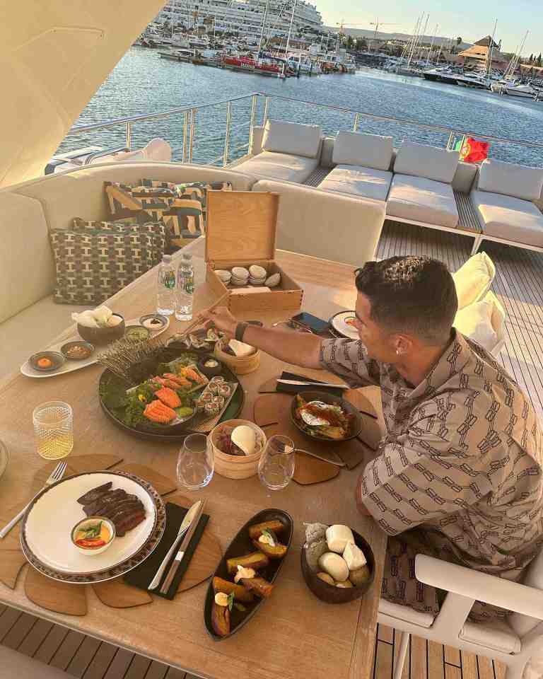 Ronaldo tucked into some food while docked up on the £5.5m vessel