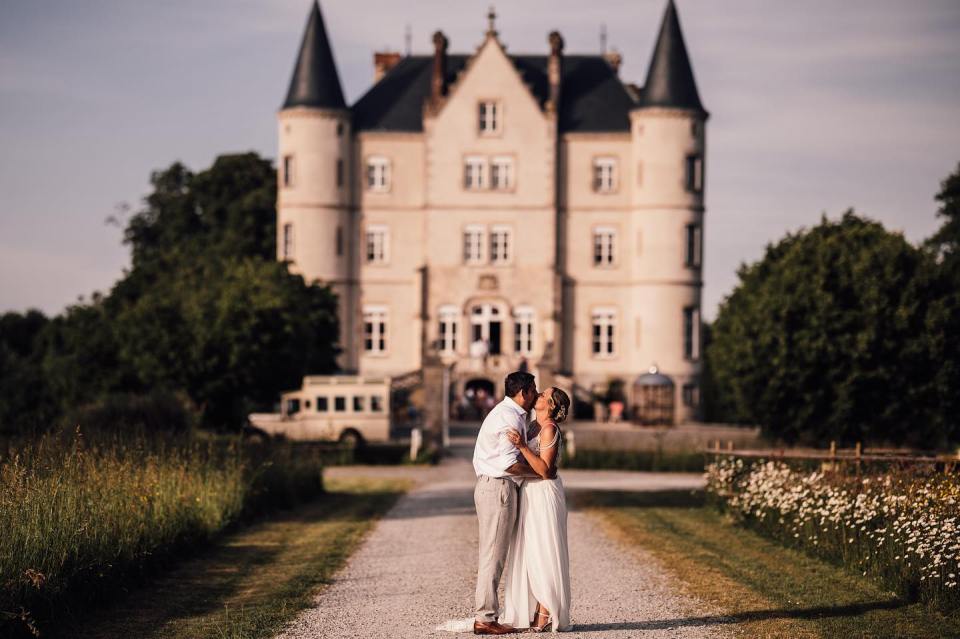 A happy couple getting married at the lavish Chateau