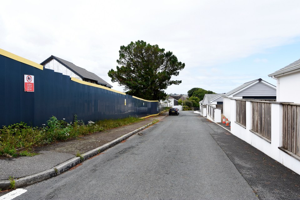 Residents look out onto the unsightly fence