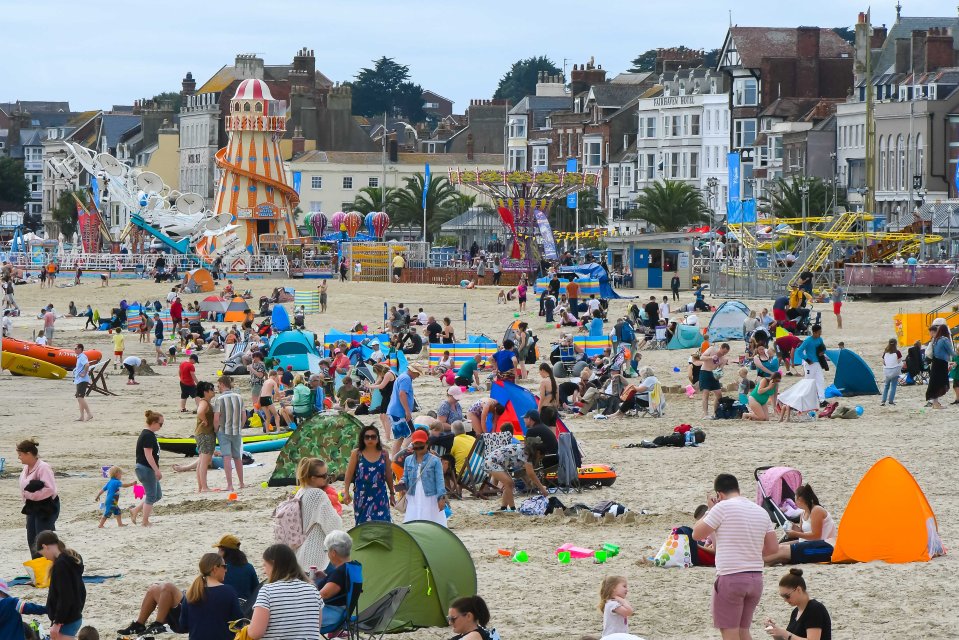 Holidaymakers on the beach in Weymouth on Saturday