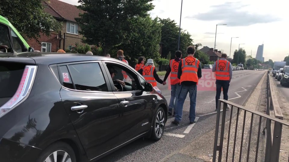 The group descended on London's Westway this morning, holding up busy Brits