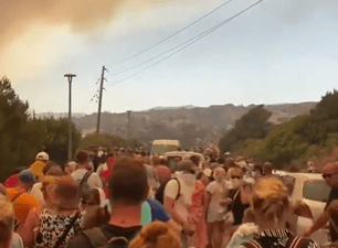 Pictures online showed columns of people fleeing villages and resorts on the island of Rhodes