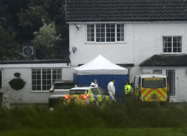 Forensics officers at the scene of the double tragedy in College Road near Thornton Abbey, Lincolnshire