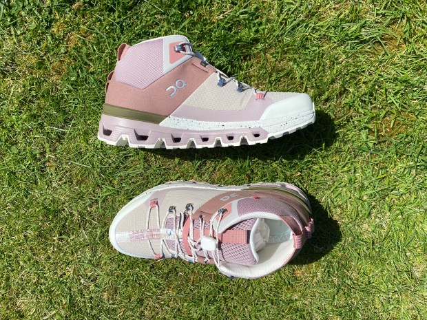 Pair of On Cloudrock hiking boots on grass.