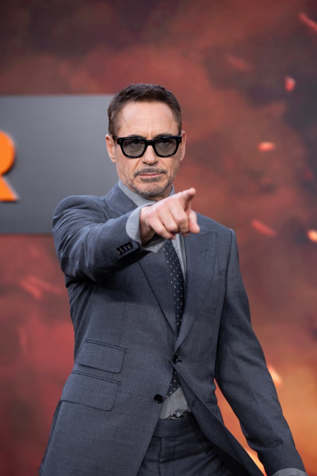 Robert Downey Jr sported a blue looking suit with a complimenting grey shirt