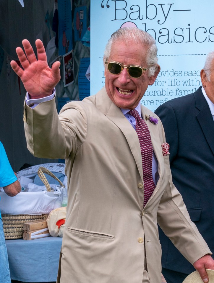 The King looked cheerful at the event as he met with royal staff members