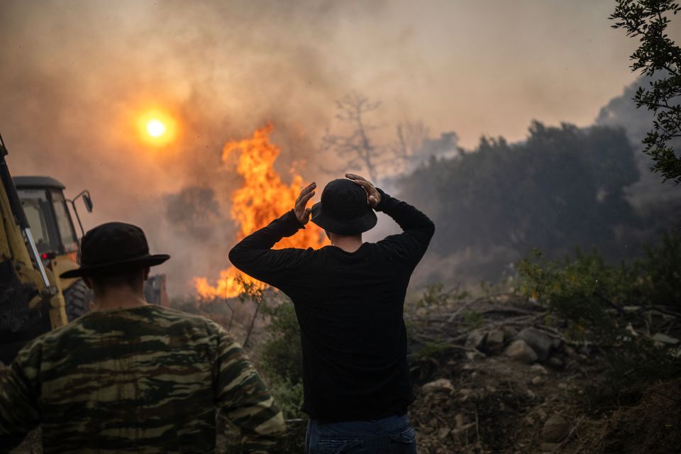 A fire burns in the village of Gennadi in Rhodes