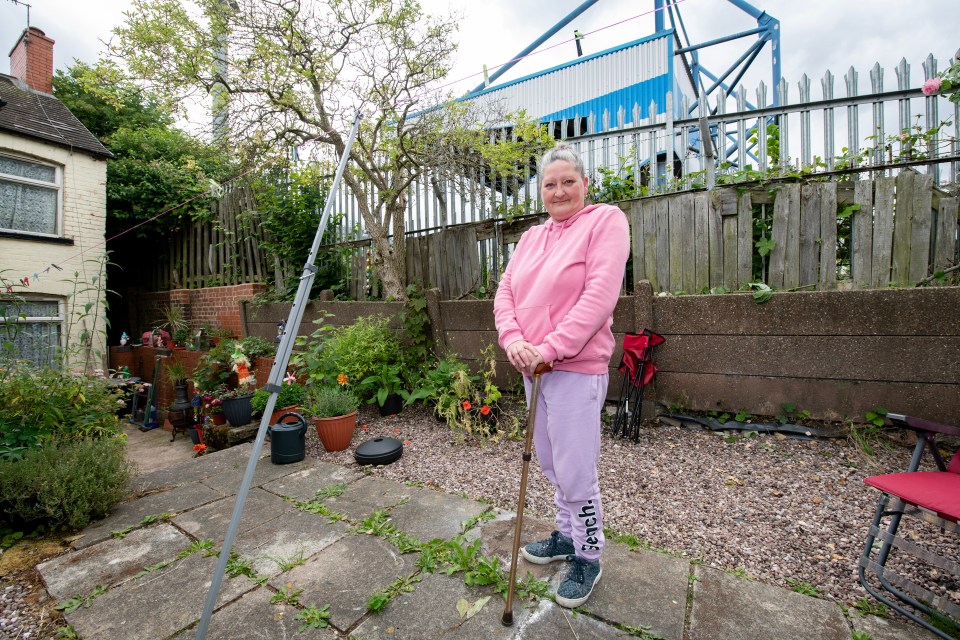 Mandy Colley, 49, whose house is next to the away supporters stand of Mansfield Town's football ground