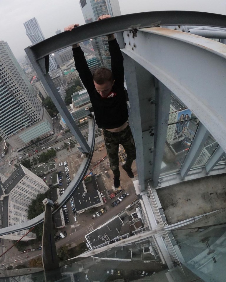 Remi in one of his daring stunts hanging by his fingertips hundreds of feet above the ground