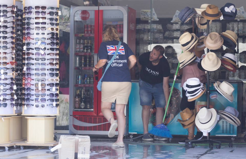 A British official visits a shop in Lindos