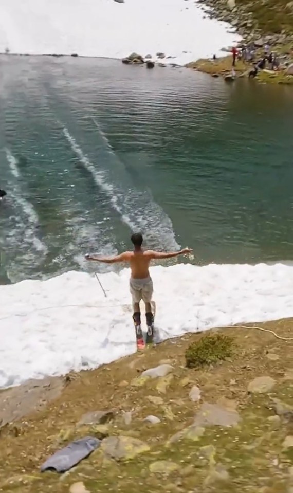 An insane trick from a skier bombing down a mountain and over water has gone viral