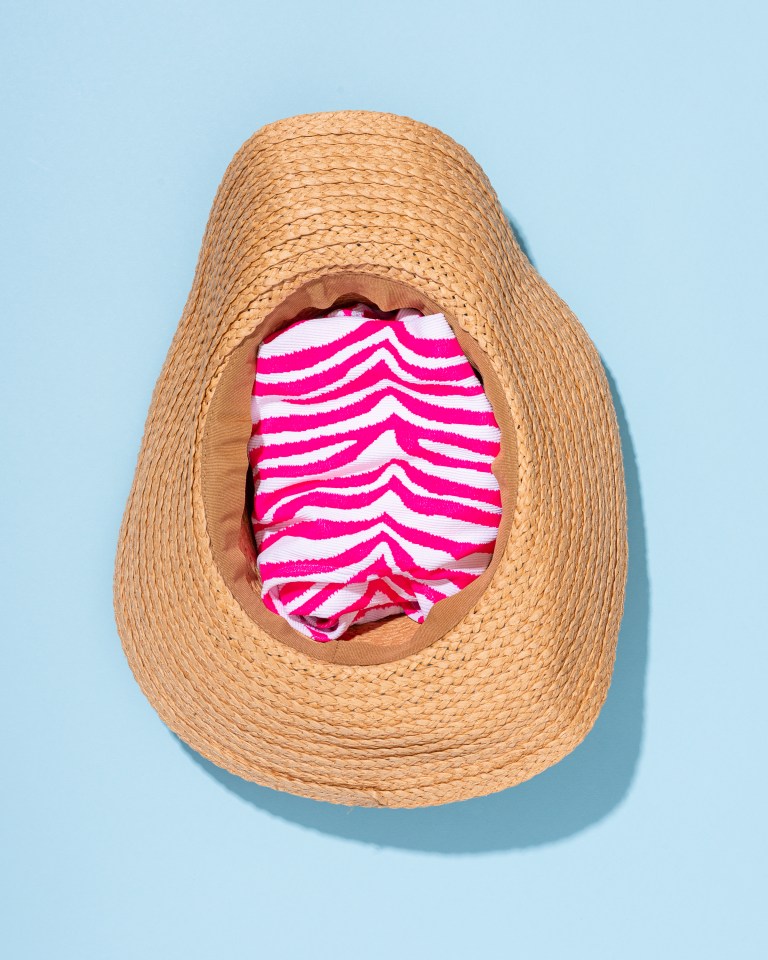 Fill your sun hat up with small items like swimsuits