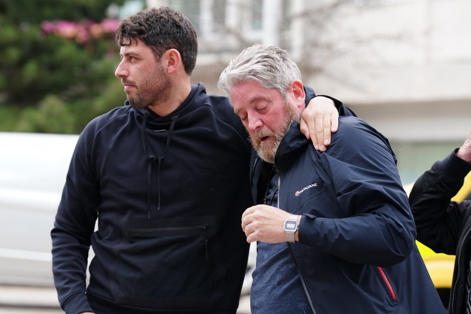 Tim is supported by a friend outside court today after Connor Chapman was found guilty of Elle's murder