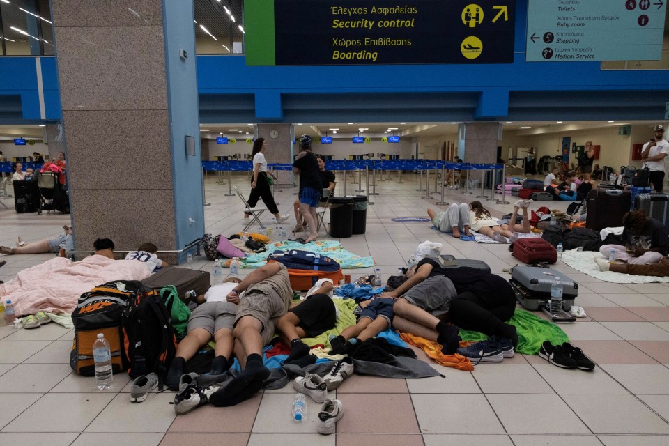 Evacuated tourists, including children, are being forced to sleep on the airport floor as the wildfires ravage Rhodes