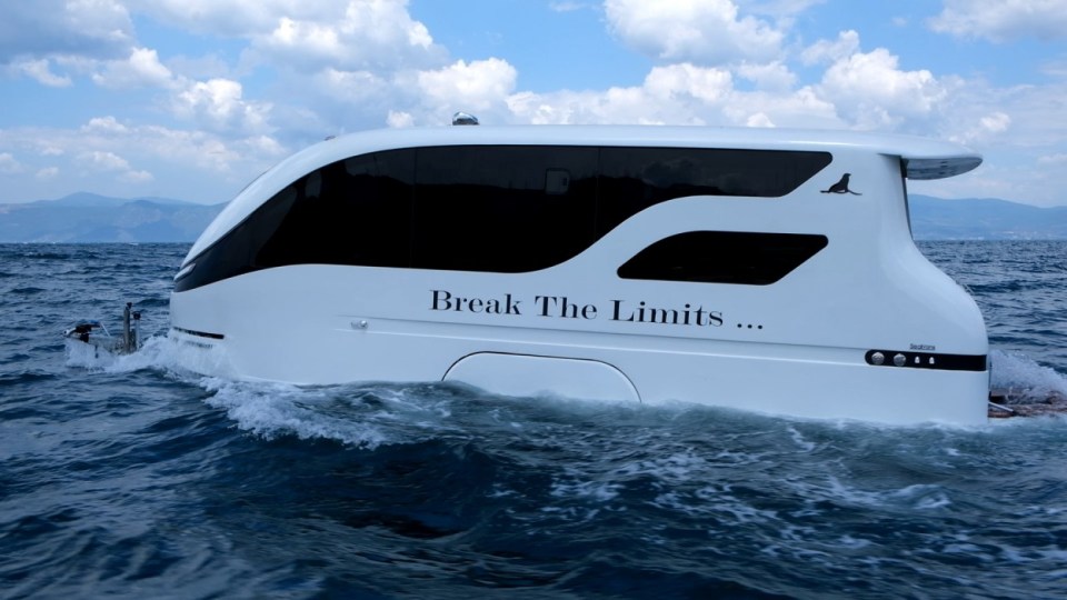 The £60,000 James-Bond style camper can be towed on land, but also manages a 15mph cruise out at sea