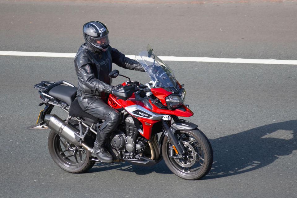 Motorbike riders must wear a helmet that meets stringent British safety standards