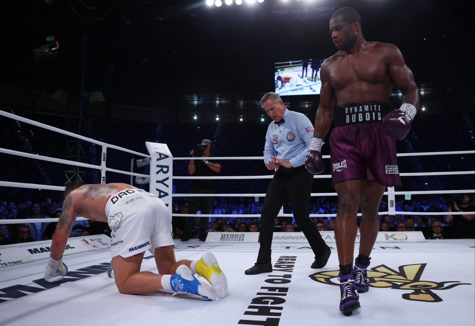 The champion struggled to get back to his feet as the referee gave him time to recover