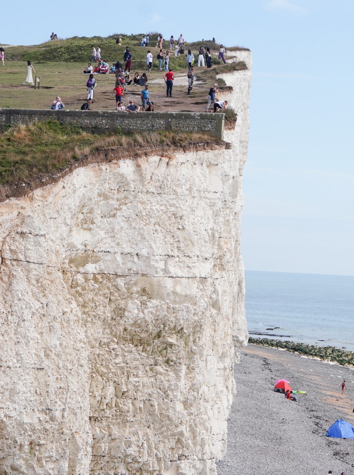 Dozens were seen posing for selfies at the National Trust cliffs on Wednesday