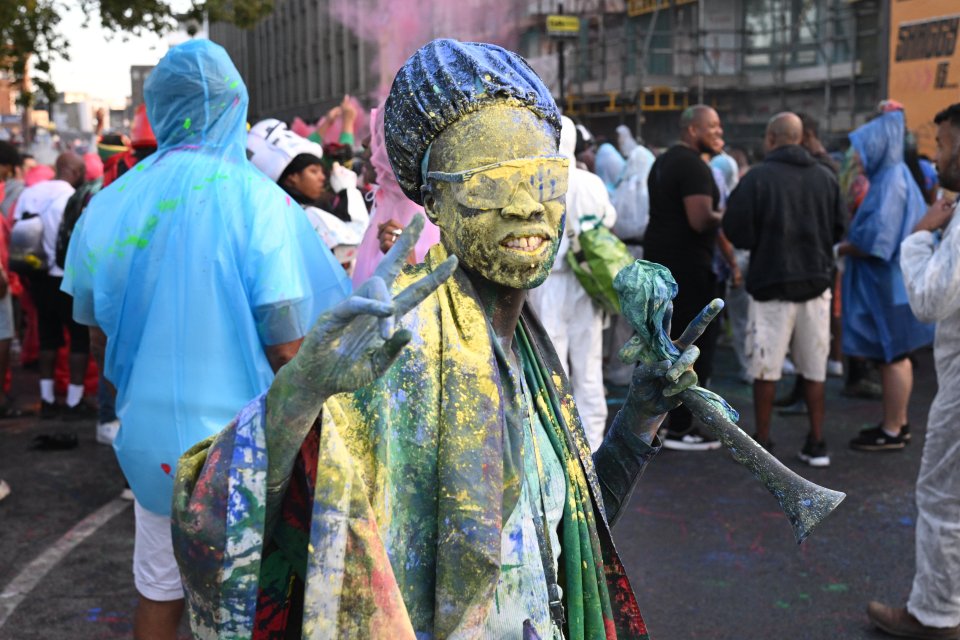 This reveller was hardly recognisable after being covered in paint