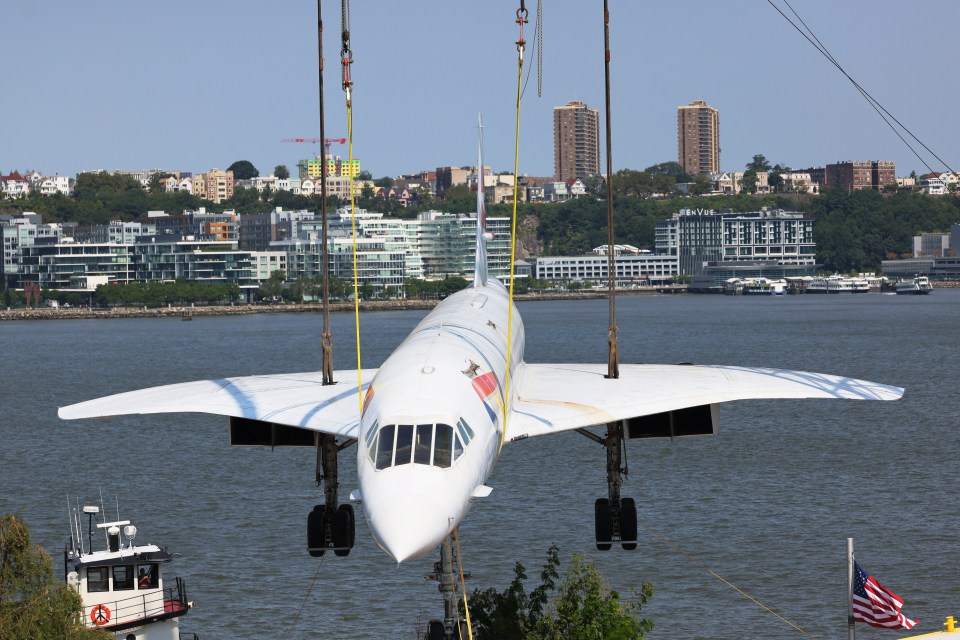 The plane was loaded onto a barge from its home at the Intrepid Museum in New York City for restoration work