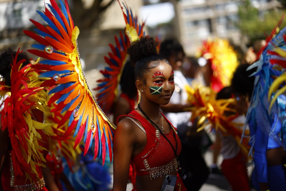 Some dancers wore brightly-coloured wings as they took part in the parade