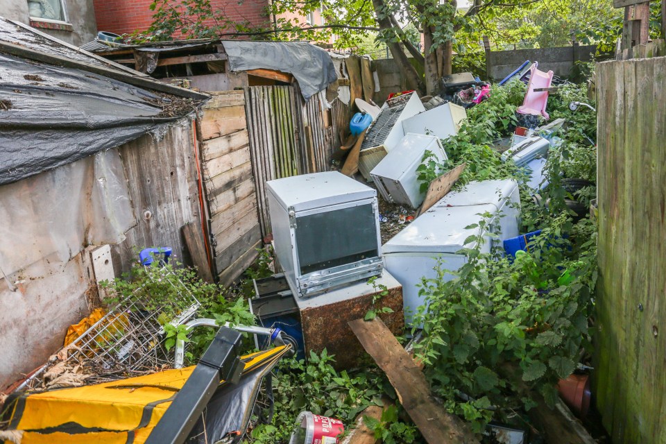 Fly-tippers have dumped piles of rubbish along an alleyway in Birmingham