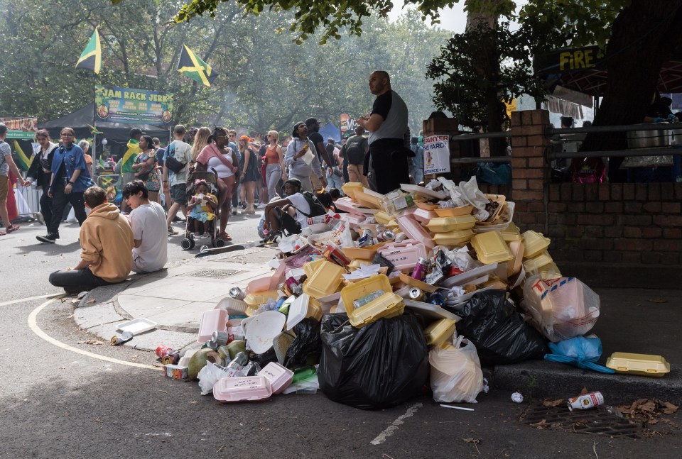 Piles of rubbish dot the area as revellers attend the Notting Hill Carnival