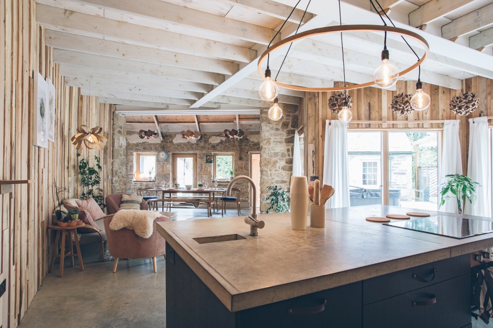 The 'wavy' house is filled with glass and wood features