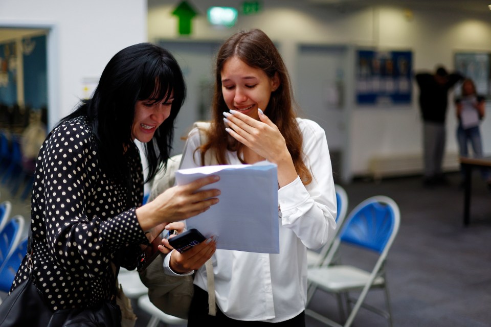 Carolina Quintino from Ukraine reacts with her mum Iryna as she receives her GCSE results at the City of London Academy