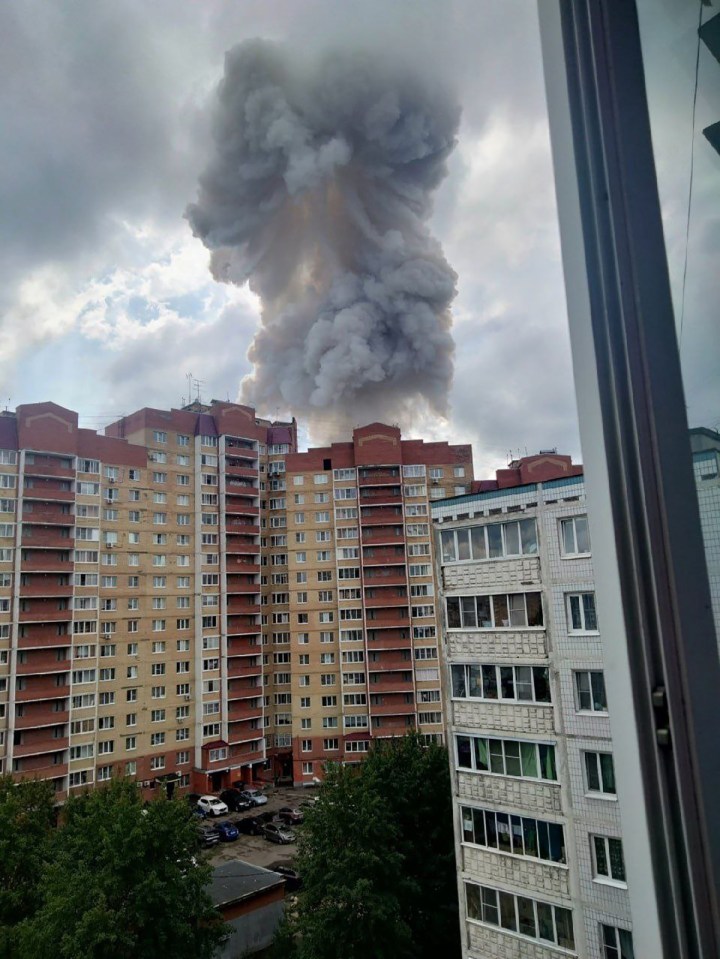 The explosion rises over tower blocks